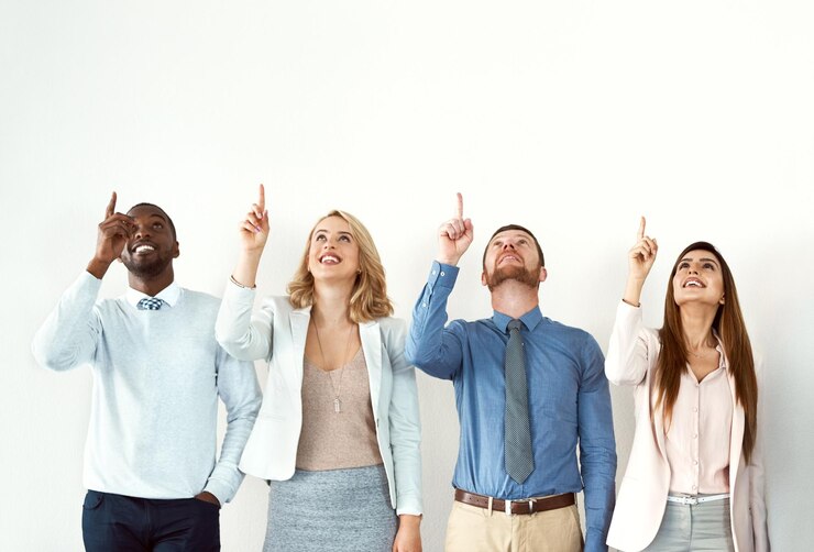 Photo business people diversity and employees pointing up wall and mockup space with collaboration happy group teamwork and coworking with hand gesture opportunity and decision with choice or solution