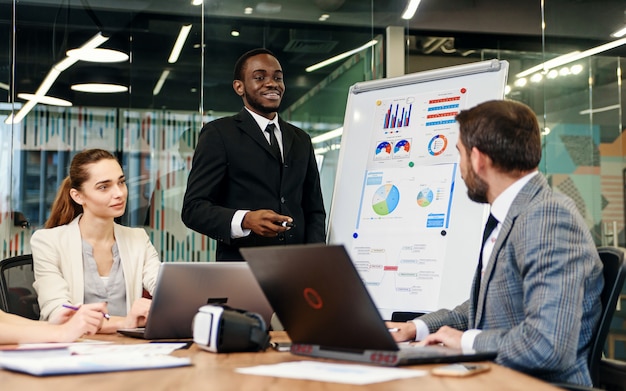 business people in formalwear discussing something