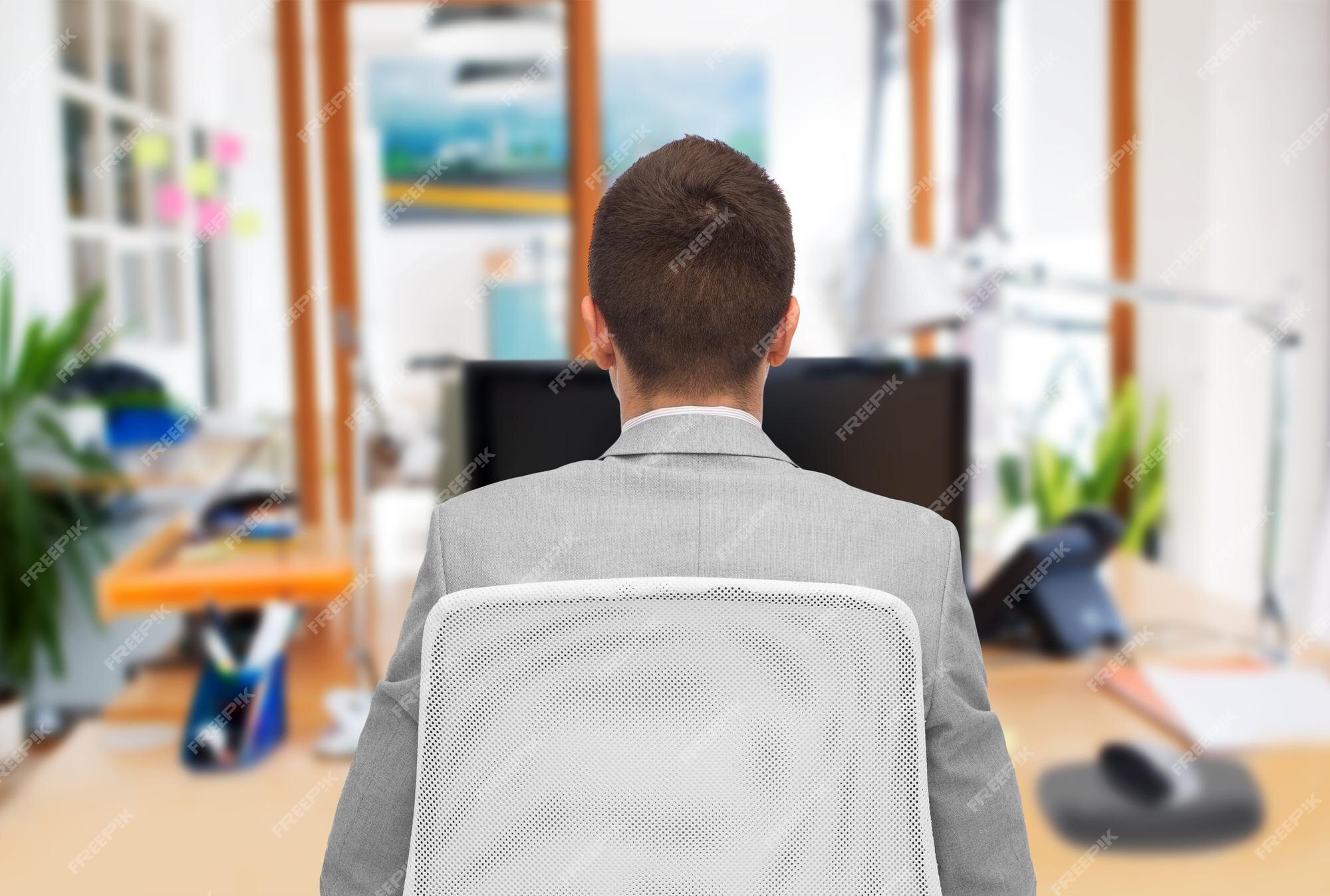 Premium Photo | Business, people, furniture, rear view and office concept -  businessman sitting in chair from back over office room background