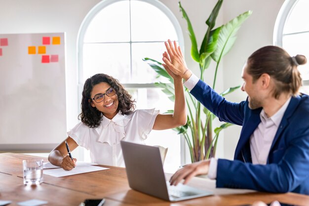 Business people giving a high five