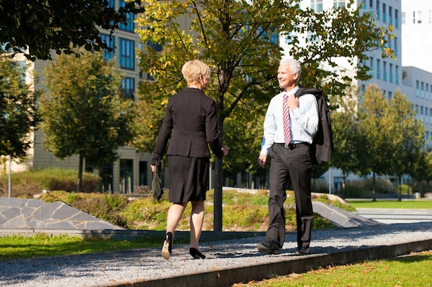 Business people greeting outdoors