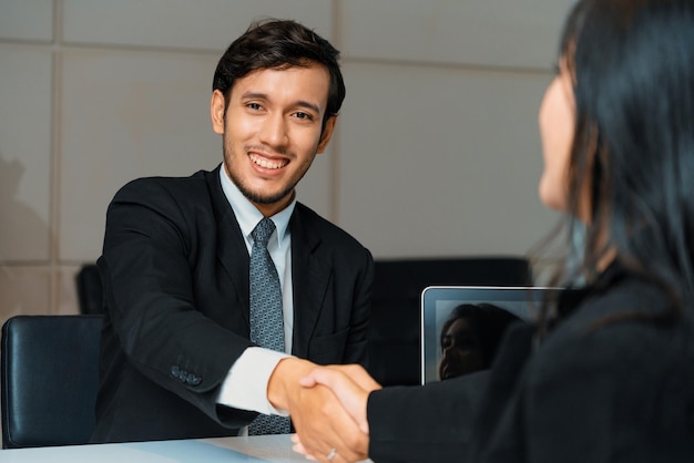 business people handshake agreement in office uds