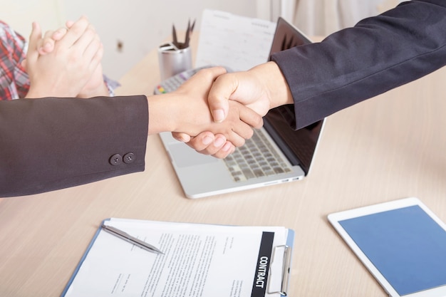 Business people handshaking after finished deal together