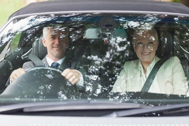 Business people having a ride in classy car