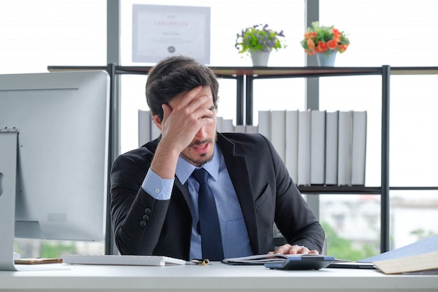 Business people headache at the office desk