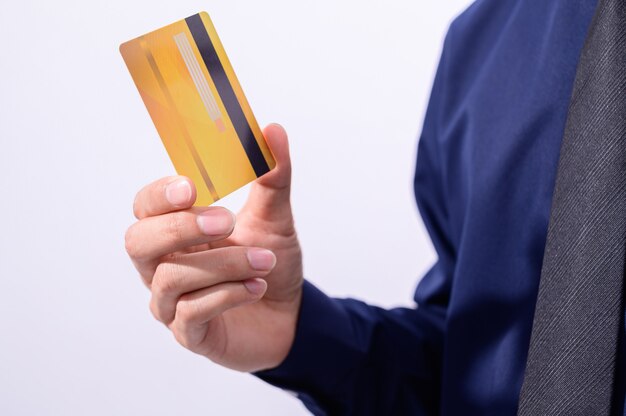 Business people hold credit cards