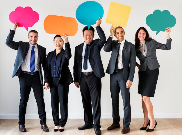 Business people holding message boxes