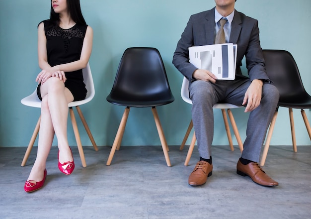 Photo business people holding paper waiting to be interviewed