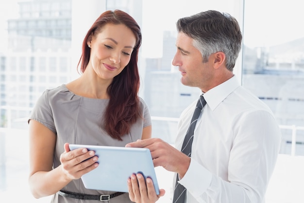 Business people holding a tablet