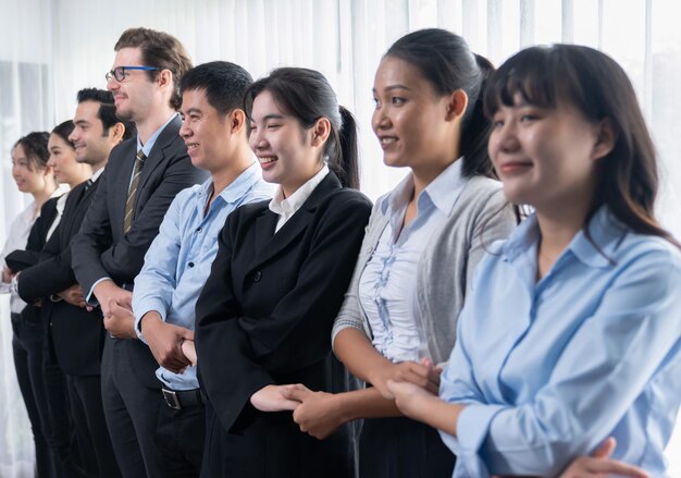 Business people joining hand together and standing in line Meticulous