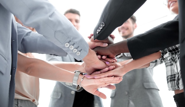 Business people joining hands in circle
