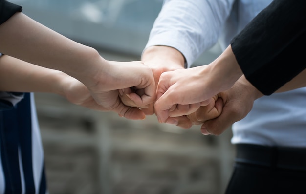 Photo business people joining hands show teamwork