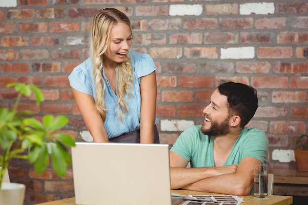 Business people laughing while working 