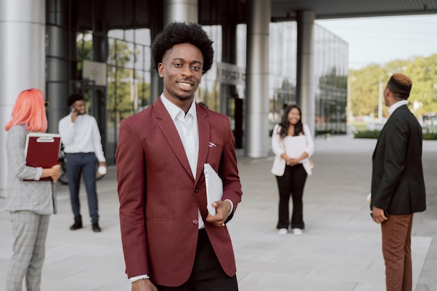 Business people leave company building outside heading
home