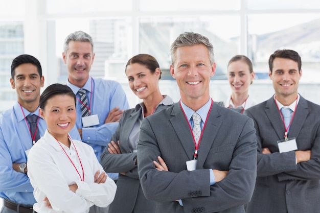 Business people looking at camera with arms crossed