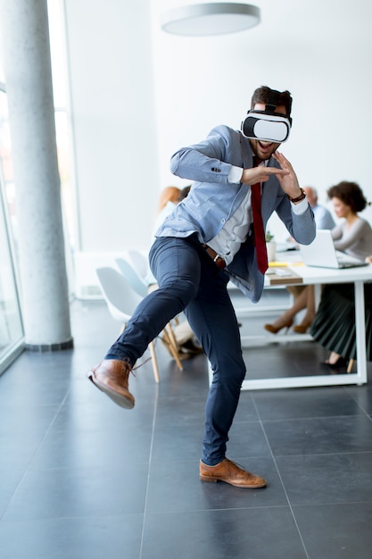 Photo business people making team training exercise during team building seminar using vr glasses