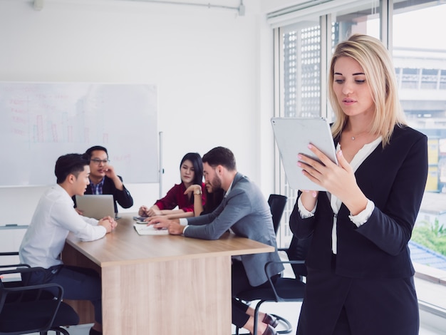 Business people in meeting room,businesswoman use laptop in board room