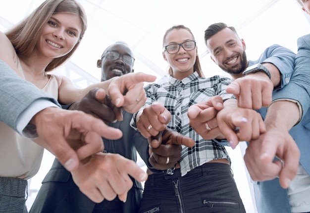 Business people pointing at the camera isolated on white