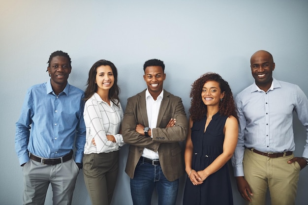 business people portrait and diversity with about us by background happy realtor group and confident in profession real estate agent team arms crossed and employees smile for career pride