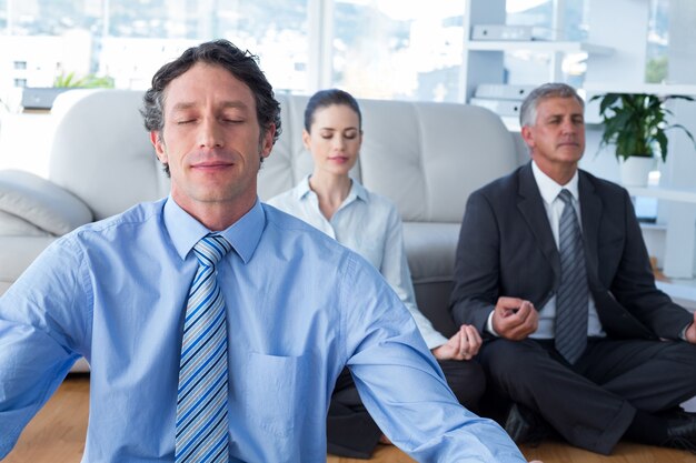 Business people practicing yoga