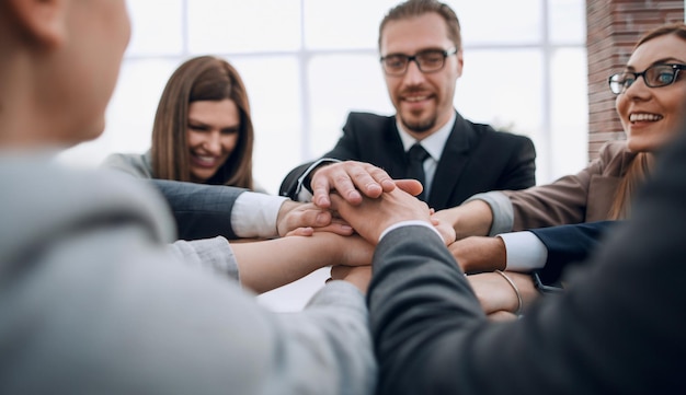 Business people putting their hands together Stack of hands