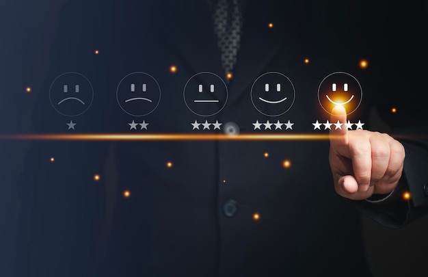 Business people rate their excellent satisfaction press the\
smiley face the concept of customer ratings and reviews service\
business and survey concept