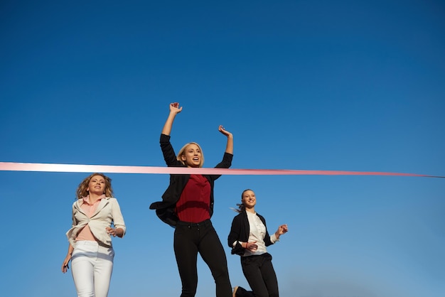 business people running together on racing track