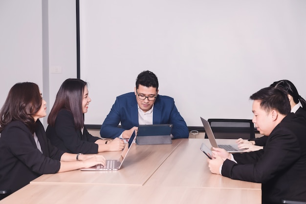 Business people  in seminar room. Meeting corporate success brainstorming teamwork