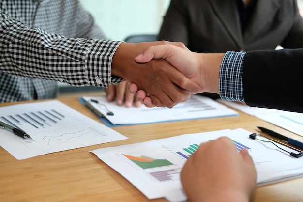 Business people shaking hands after meeting. 