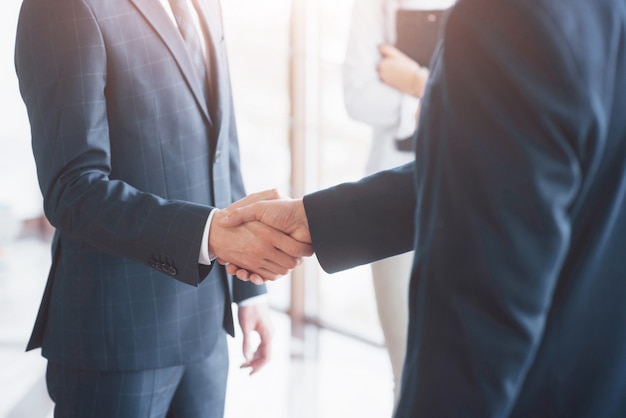 Business people shaking hands, finishing up a meeting