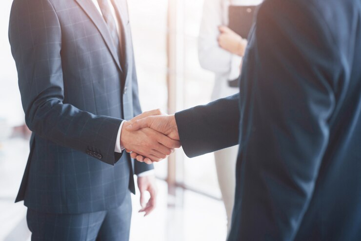 Photo business people shaking hands, finishing up a meeting