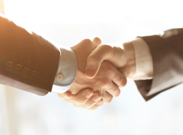 Business people shaking hands finishing up meeting