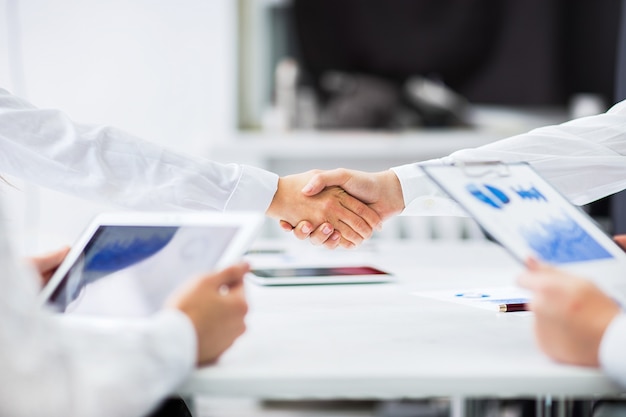 Business people shaking hands, finishing up a meeting