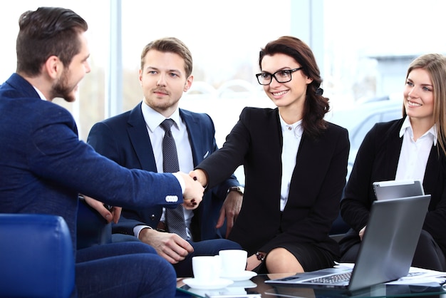 Business people shaking hands, finishing up a meeting