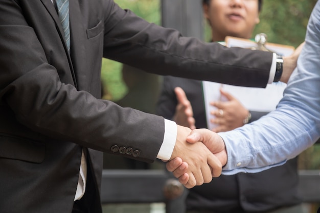 Business people shaking hands, finishing up a meeting