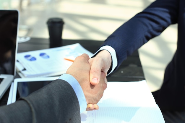 Business people shaking hands, finishing up a meeting