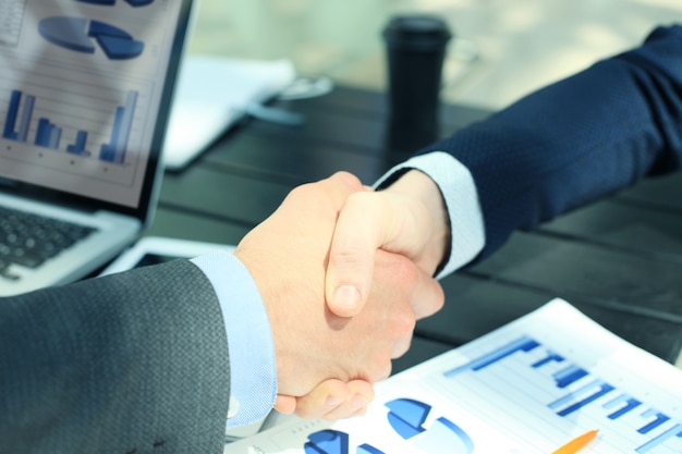 Business people shaking hands, finishing up a meeting