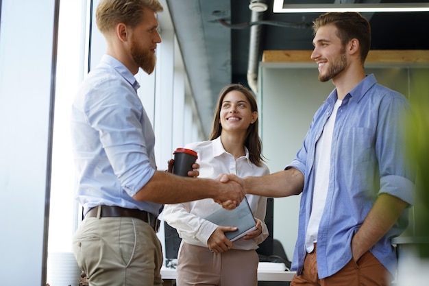 Business people shaking hands, finishing up a meeting