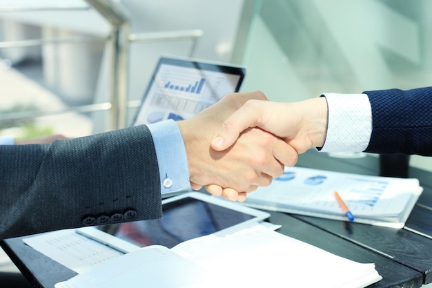 Business people shaking hands, finishing up a meeting