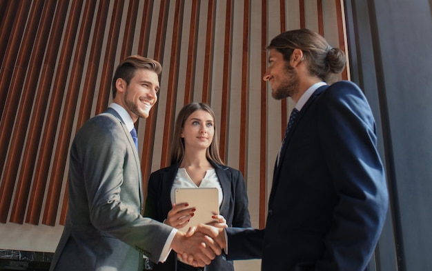 business people shaking hands finishing up a meeting