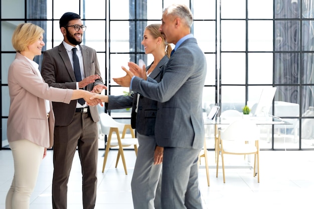 Business people shaking hands finishing up a meeting