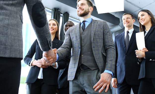 Business people shaking hands, finishing up a meeting