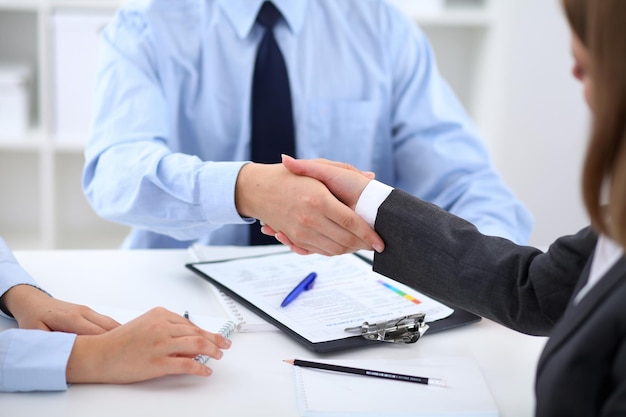 Business people shaking hands finishing up a meeting