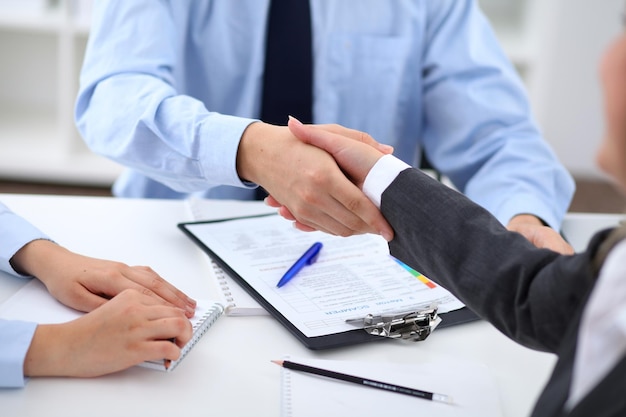 Business people shaking hands finishing up a meeting