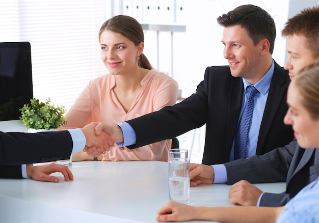 Business people shaking hands finishing up a meeting