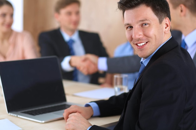 Business people shaking hands finishing up a meeting