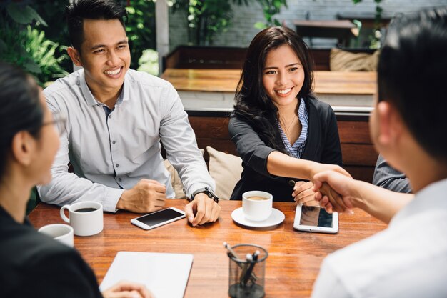 Business people shaking hands, finishing up a meeting