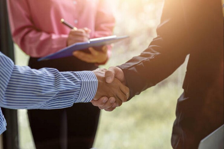 Photo business people shaking hands finishing up a meetingbusinessman handshake for teamwork of business merger and acquisition