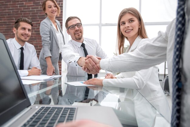 Business people shaking hands at the office tableconcept of cooperation