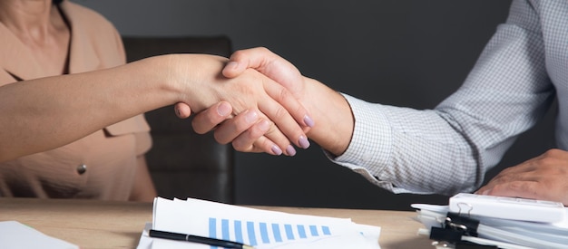 Business people shaking hands in office